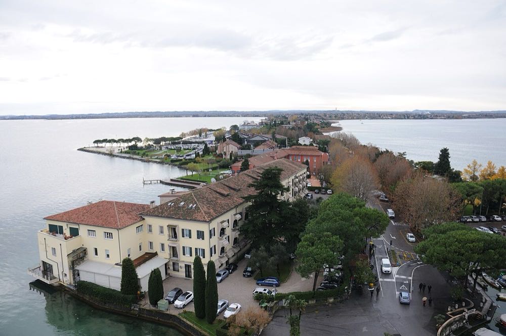 Lake Garda and the Sirmione peninsula seen from the Scaligero Castle, with the walled old town below