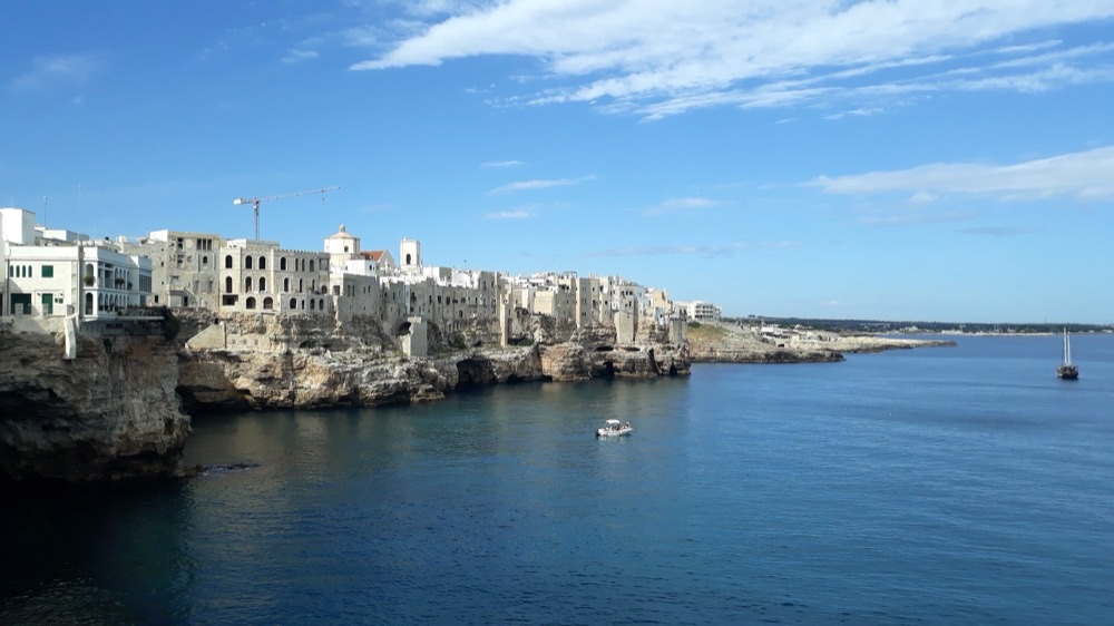 The clifftop old town of Polignano a Mare in Puglia, its white houses standing on limestone above the Adriatic