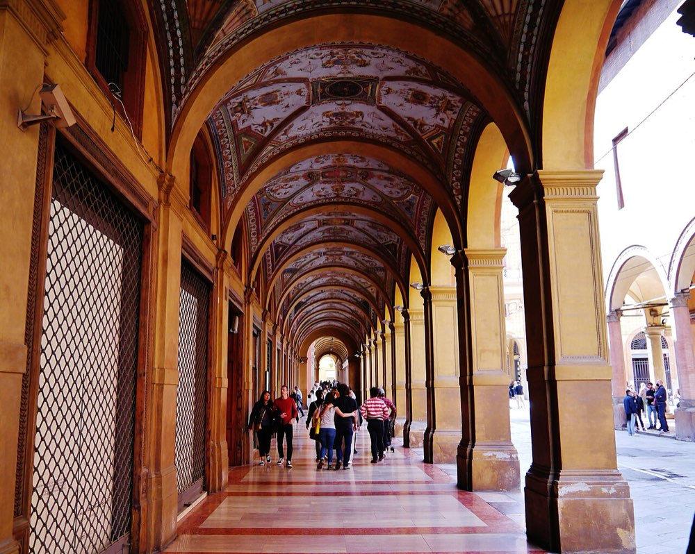A porticoed historic street (Via Farini) in central Bologna, inside the ZTL